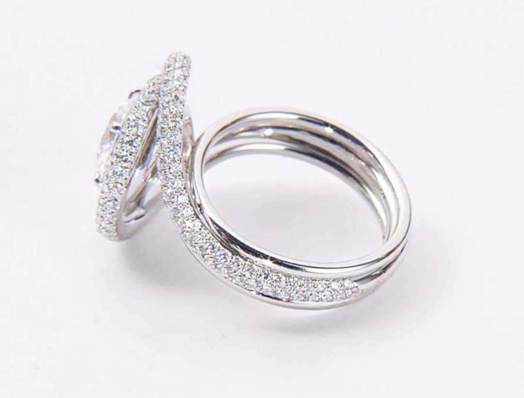 Side view showing raised spiral basket and multi-band construction of diamond ring