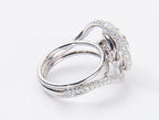 High angle profile view of pave-set spiral halo lab diamond engagement ring