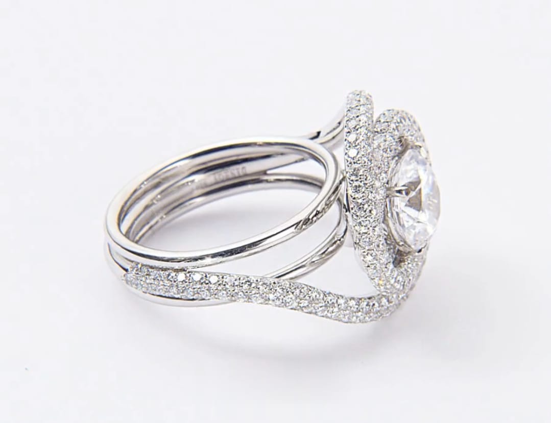 Full side profile shot showcasing the height and pave details of round diamond spiral ring