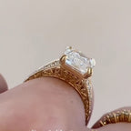 Side profile of a 4 carat radiant cut lab grown diamond engagement ring with intricate filigree gold gallery.