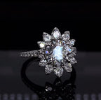 Front view of 3 carat round cut lab grown diamond engagement ring with floral sunburst halo.
