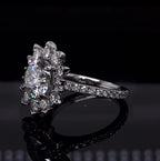 Three-quarter view showing pavé diamond band on a round lab grown diamond floral halo ring.