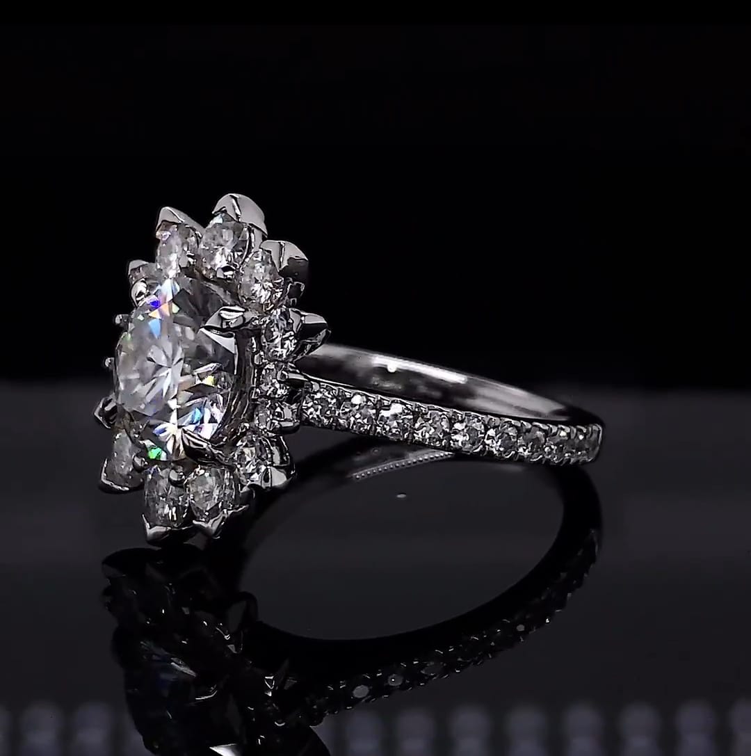 Three-quarter view showing pavé diamond band on a round lab grown diamond floral halo ring.
