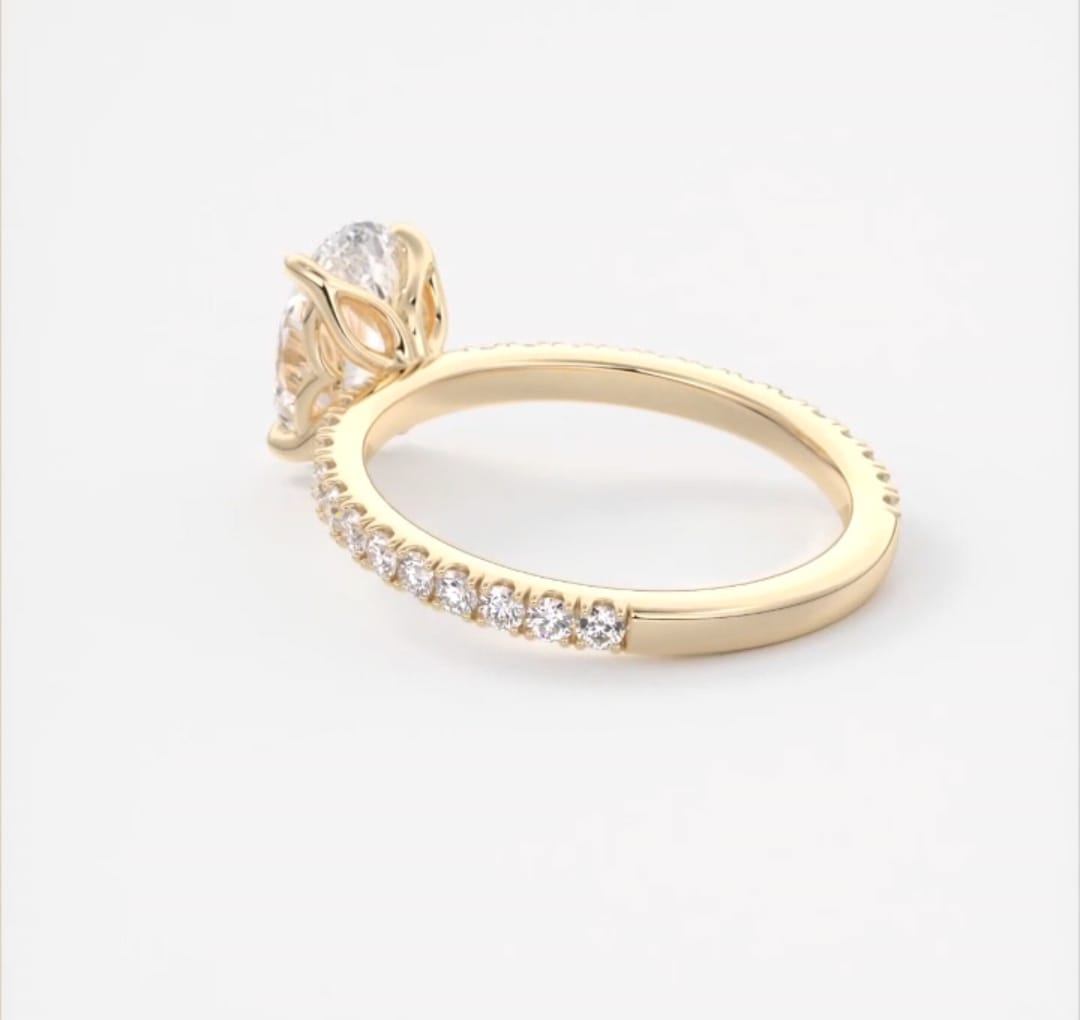 Profile angle highlighting the tulip petal basket setting of an oval lab grown diamond ring.
