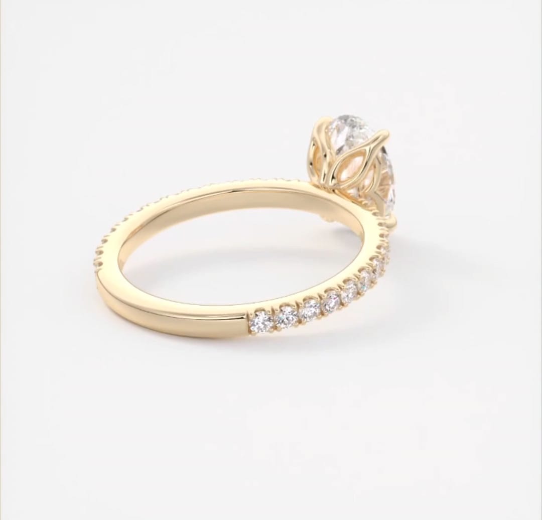 Back perspective showing solid gold polished shank transitioning into pave diamonds.