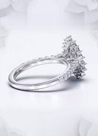 Profile angle displaying the elevated starburst halo basket on a white gold pear engagement ring.