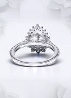 Underneath view showing the intricate petal basket design on a pear cut lab grown diamond ring.