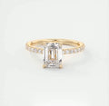 Top front view highlighting the clear step cut facets of a 2 carat emerald cut lab diamond ring.