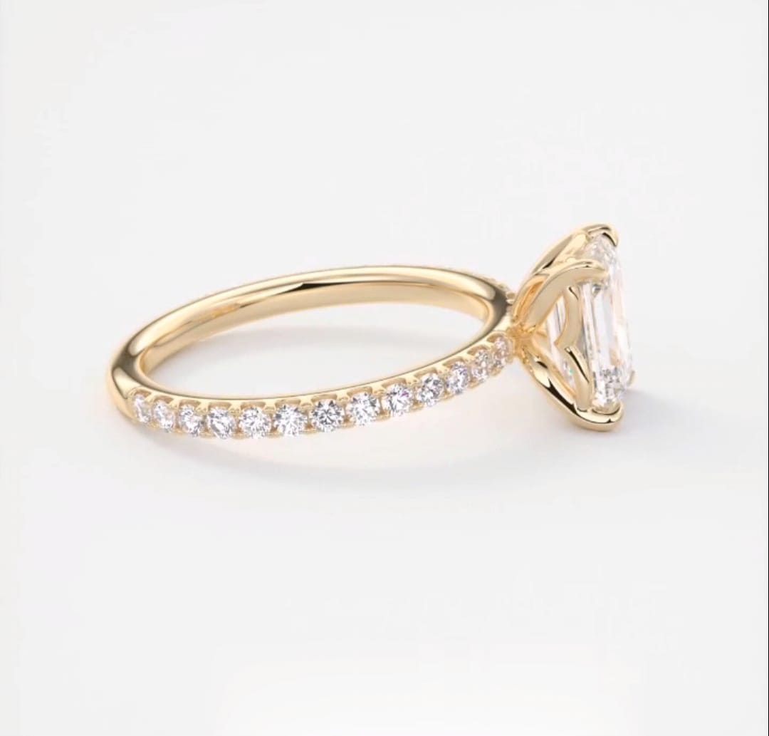 Side angle showcasing the brilliant round pavé diamonds along the yellow gold band.