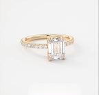Straight-on front view showing the 2 carat emerald lab grown diamond set in yellow gold.