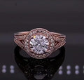 Front view of 2 CT round cut lab grown diamond halo engagement ring in rose gold