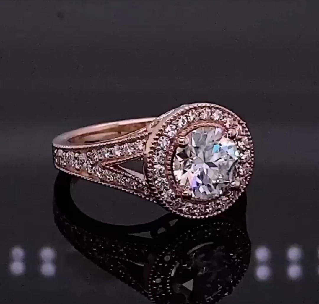 Angled view showing halo and split shank pave diamonds on rose gold ring