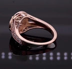 Close-up of vintage filigree gallery and hidden accent diamond on rose gold ring