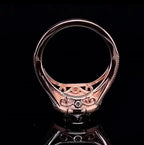 Bottom profile view highlighting filigree scroll detailing and smooth polished band