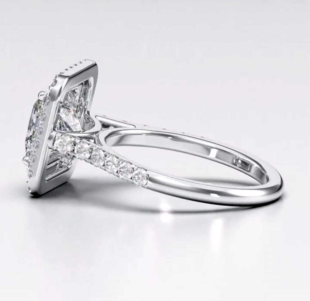 Side angle showing cathedral setting and pave band on princess cut lab diamond ring