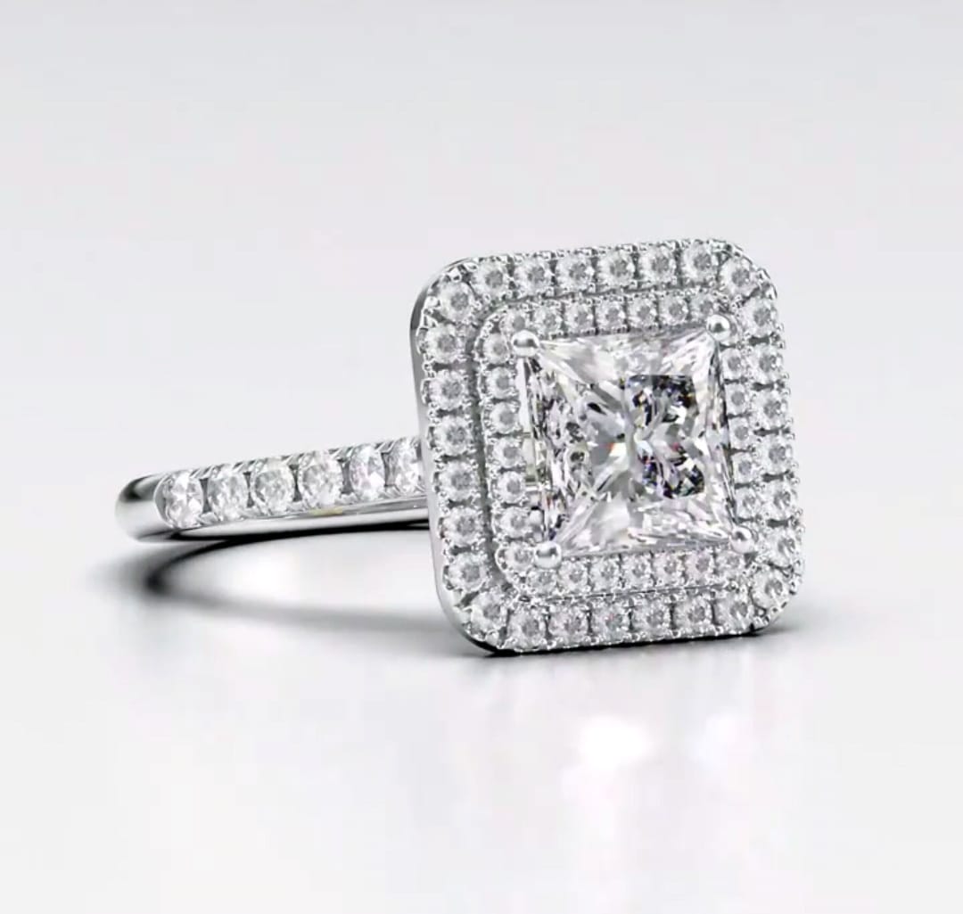 Perspective view highlighting the square double halo and sparkling princess cut diamond