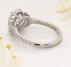 Close-up view highlighting the open-work undergallery bridge and crescent accents on a lab diamond ring