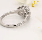 Rear angle perspective of 4-prong setting and pave band on a platinum oval lab diamond ring