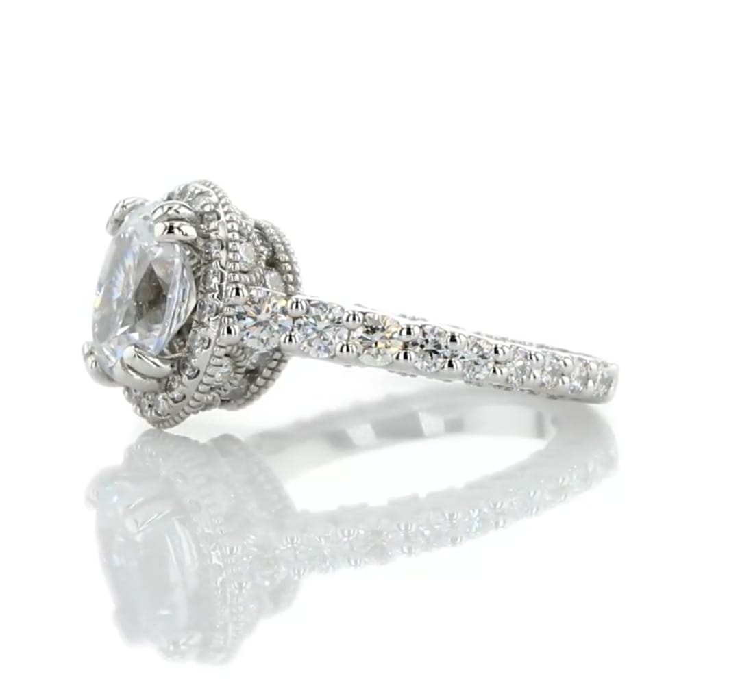 Side profile showing the raised halo setting and pave diamond band of a 2 carat oval lab grown ring.