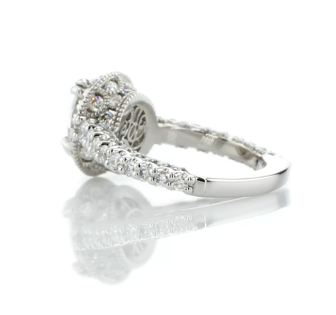 Detailed angle showing the vintage filigree gallery and paved underside of a 2ct oval lab diamond ring.