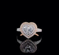 Direct top-down view showing the 2 CT heart cut lab diamond surrounded by a double halo frame on a sleek black background.