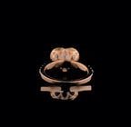 Underneath view displaying the polished rose gold band and back of the heart-shaped halo setting.