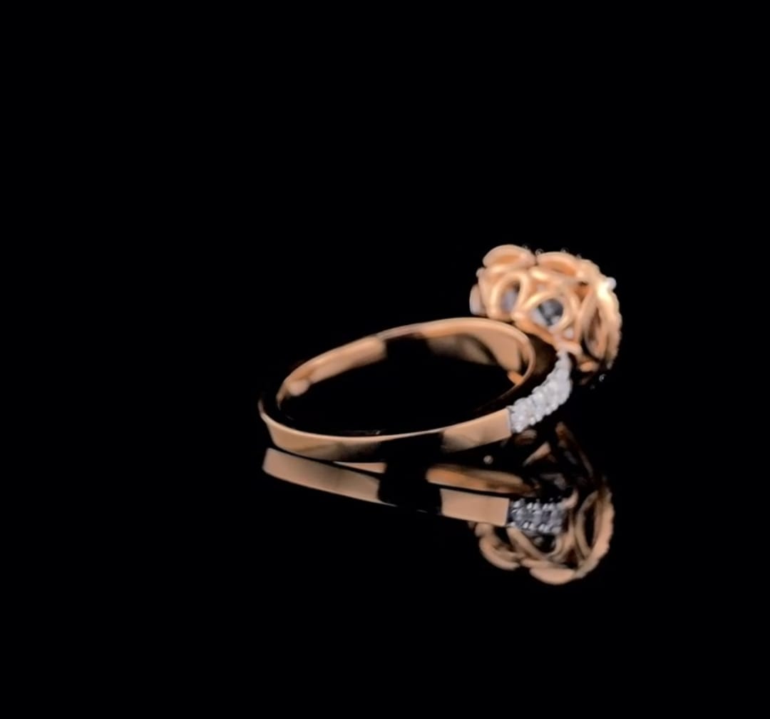 Angled back profile view showing the smooth rose gold shank and ornate halo gallery of a heart cut diamond ring.