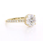 Side angle of 3 CT round lab grown diamond ring in yellow gold with pavé band