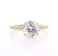 Top-down view of 3 CT round brilliant cut lab grown diamond yellow gold ring