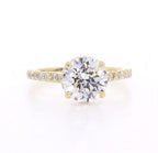 Top-down view of 3 CT round brilliant cut lab grown diamond yellow gold ring