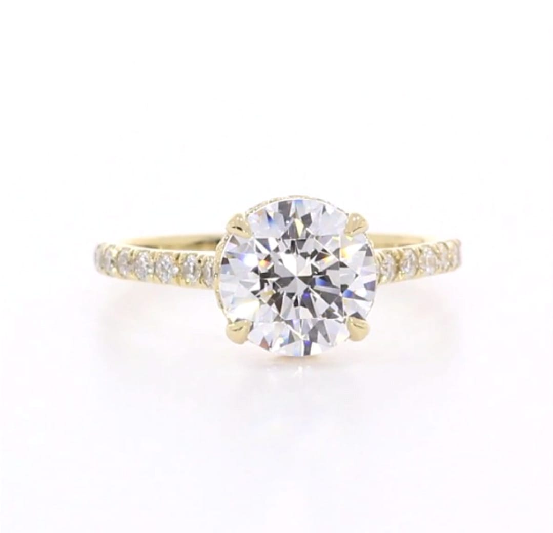 Top-down view of 3 CT round brilliant cut lab grown diamond yellow gold ring