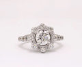 Top-down view of 2 CT round lab grown diamond ring with scalloped starburst halo