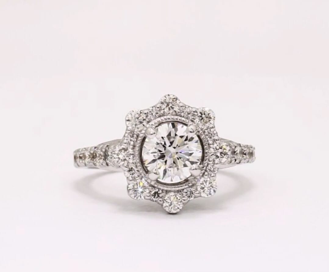 Top-down view of 2 CT round lab grown diamond ring with scalloped starburst halo