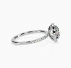 Side view showing micro-pavé band and classic halo basket on white gold ring