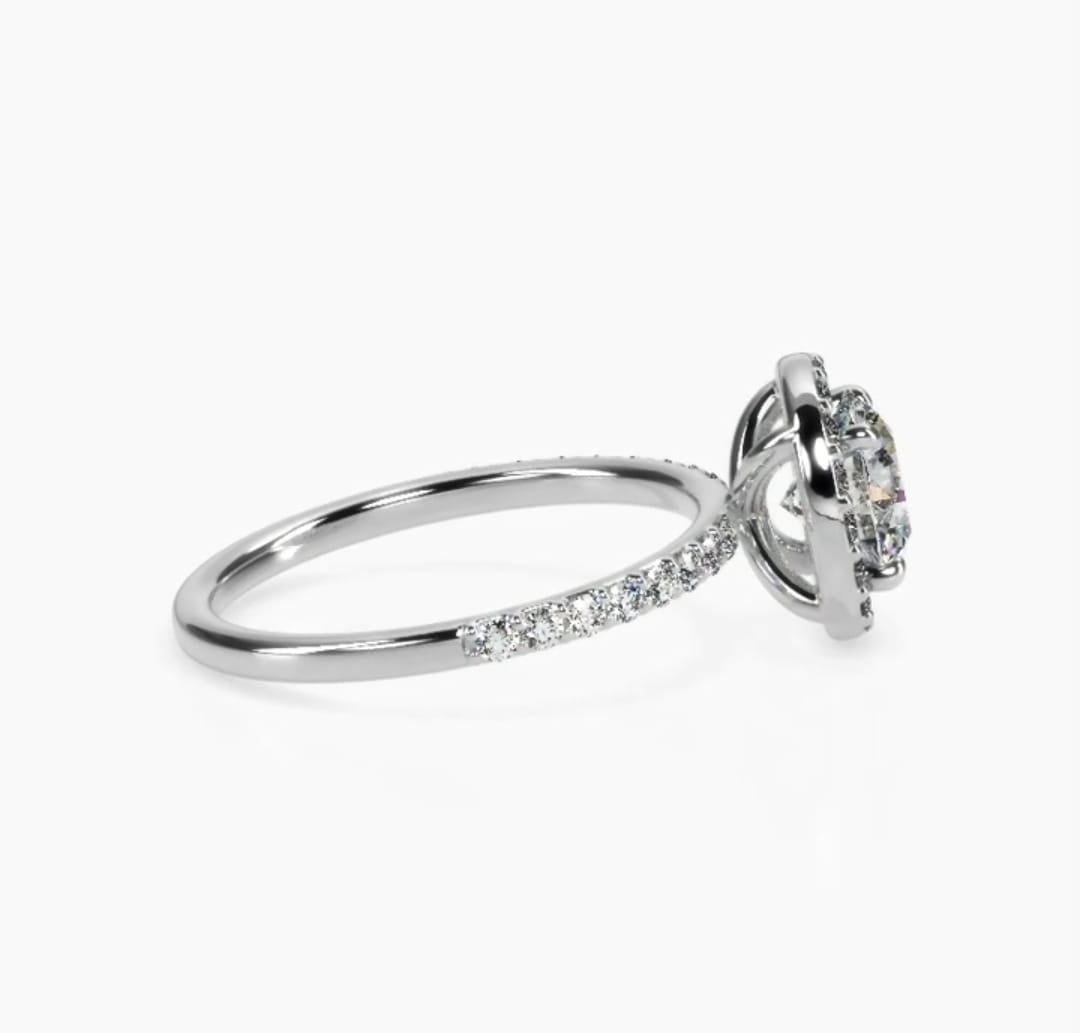 Side view showing micro-pavé band and classic halo basket on white gold ring