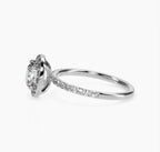 Profile view showcasing slim white gold micro-pavé band and round halo setting