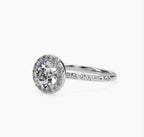 3/4 angle view highlighting the brilliant center round diamond and seamless halo