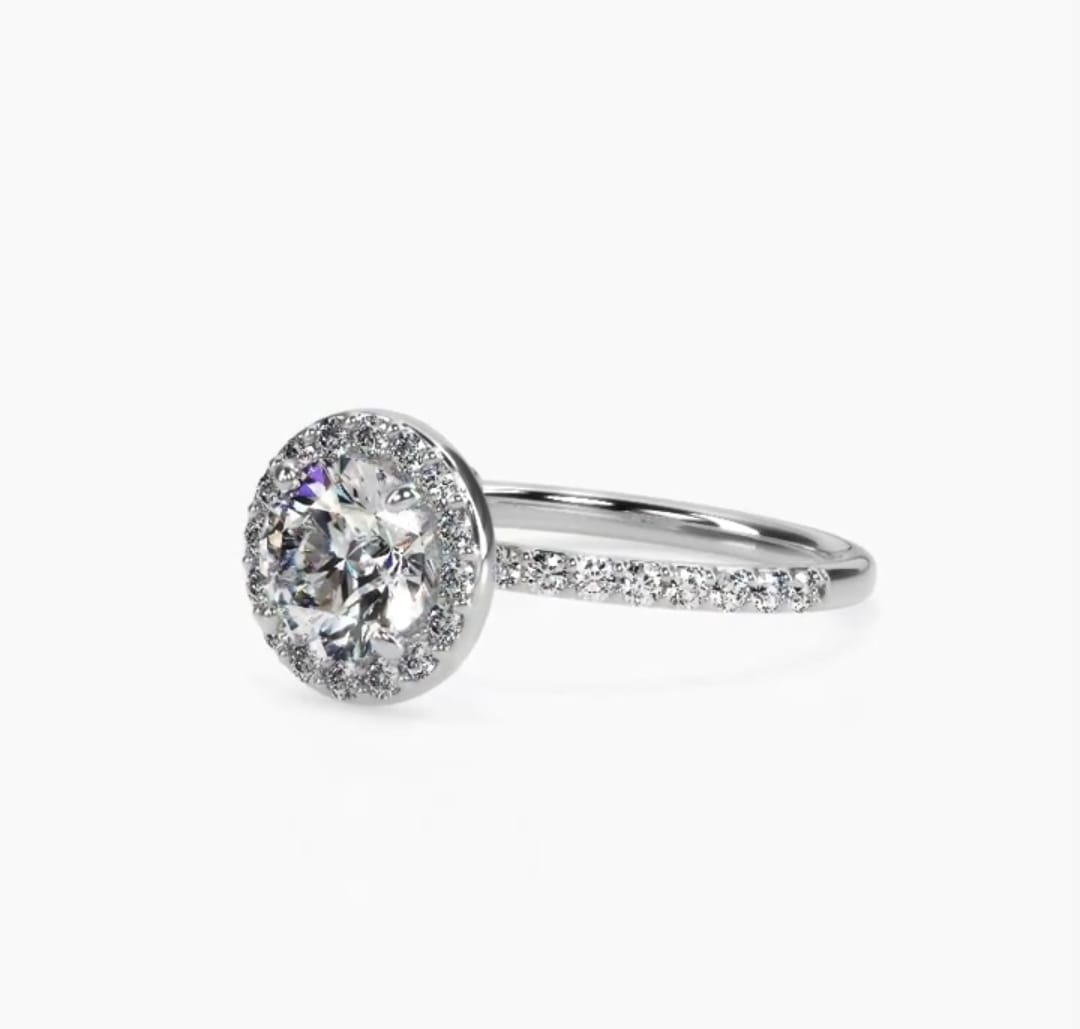 3/4 angle view highlighting the brilliant center round diamond and seamless halo