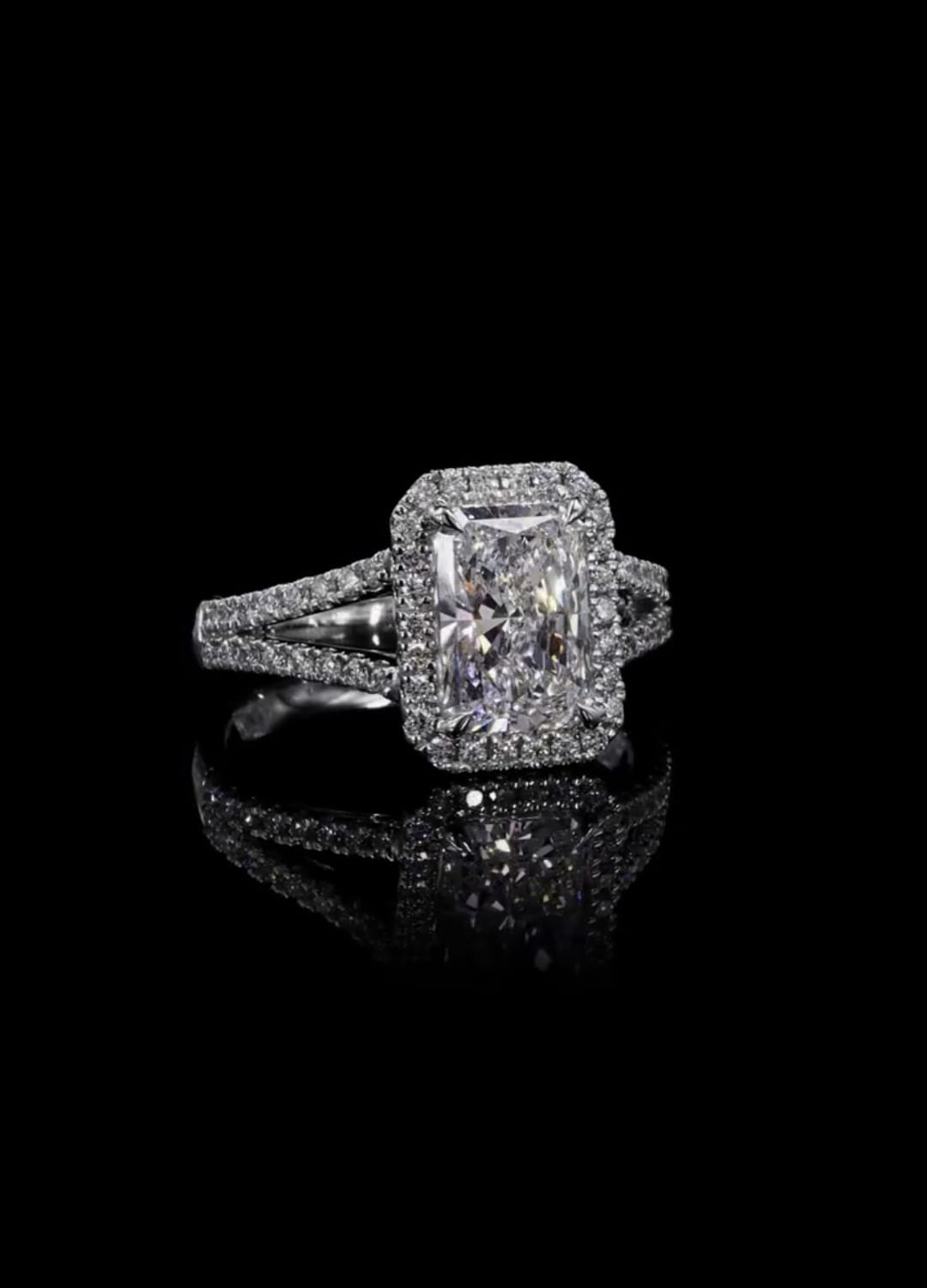 Front view of 3 CT radiant cut lab grown diamond ring with halo and split shank band