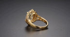 Side profile detailing openwork filigree undergallery and smooth yellow gold band
