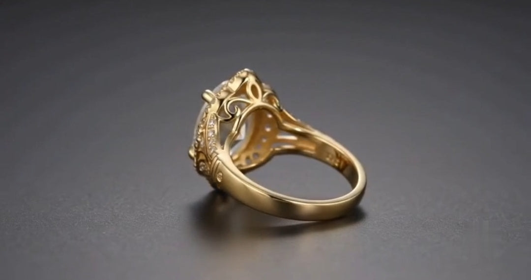 Side profile detailing openwork filigree undergallery and smooth yellow gold band
