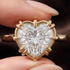 Close-up macro view of a 3 CT heart cut lab grown diamond engagement ring with multi-prong gold frame.