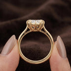 On-finger view of a 3 carat heart cut lab grown diamond solitaire engagement ring in yellow gold.