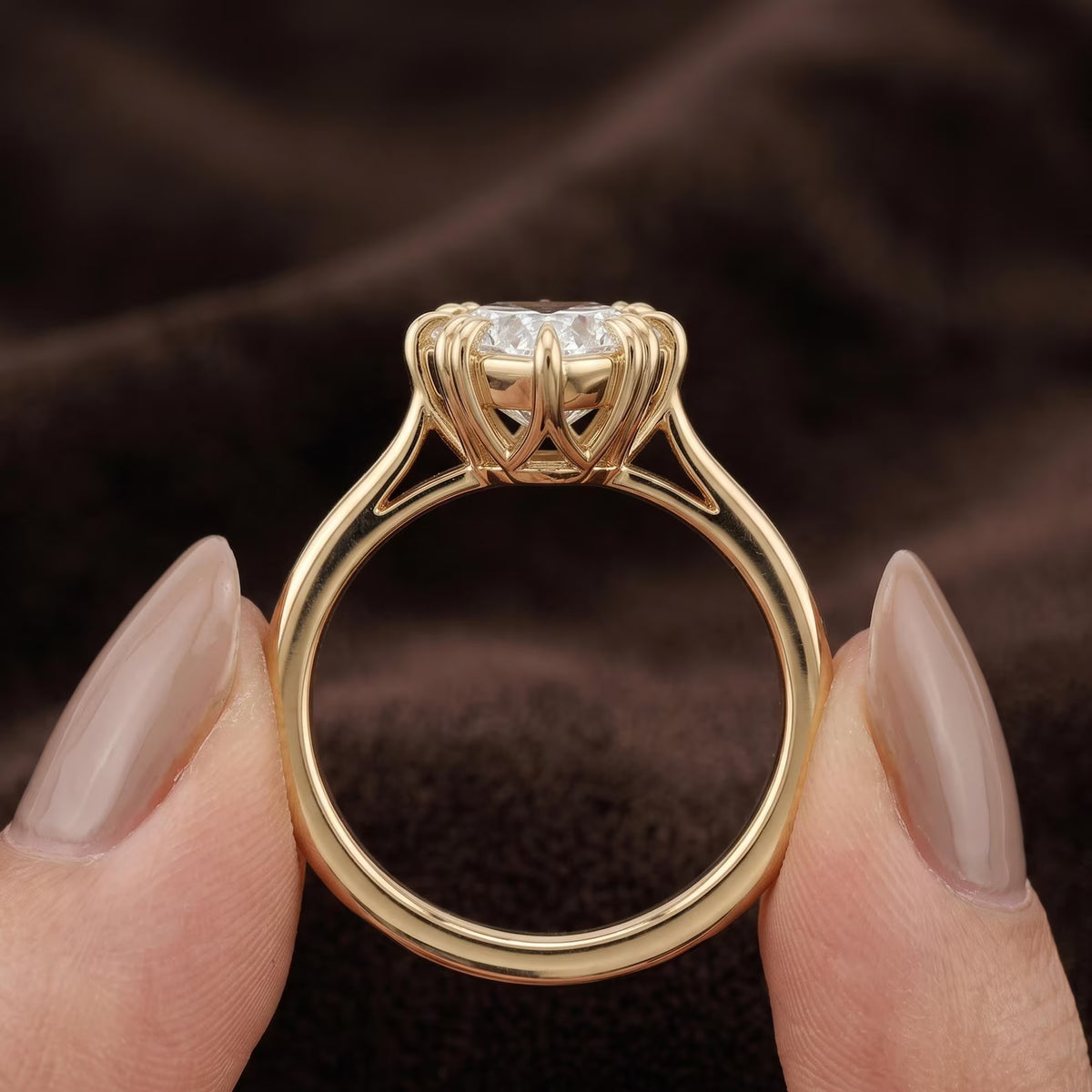 On-finger view of a 3 carat heart cut lab grown diamond solitaire engagement ring in yellow gold.