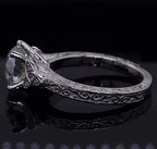 Profile view of vintage style engagement ring featuring 2CT round lab diamond