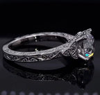 Side profile displaying Celtic trinity knot accents and brilliant round lab diamond