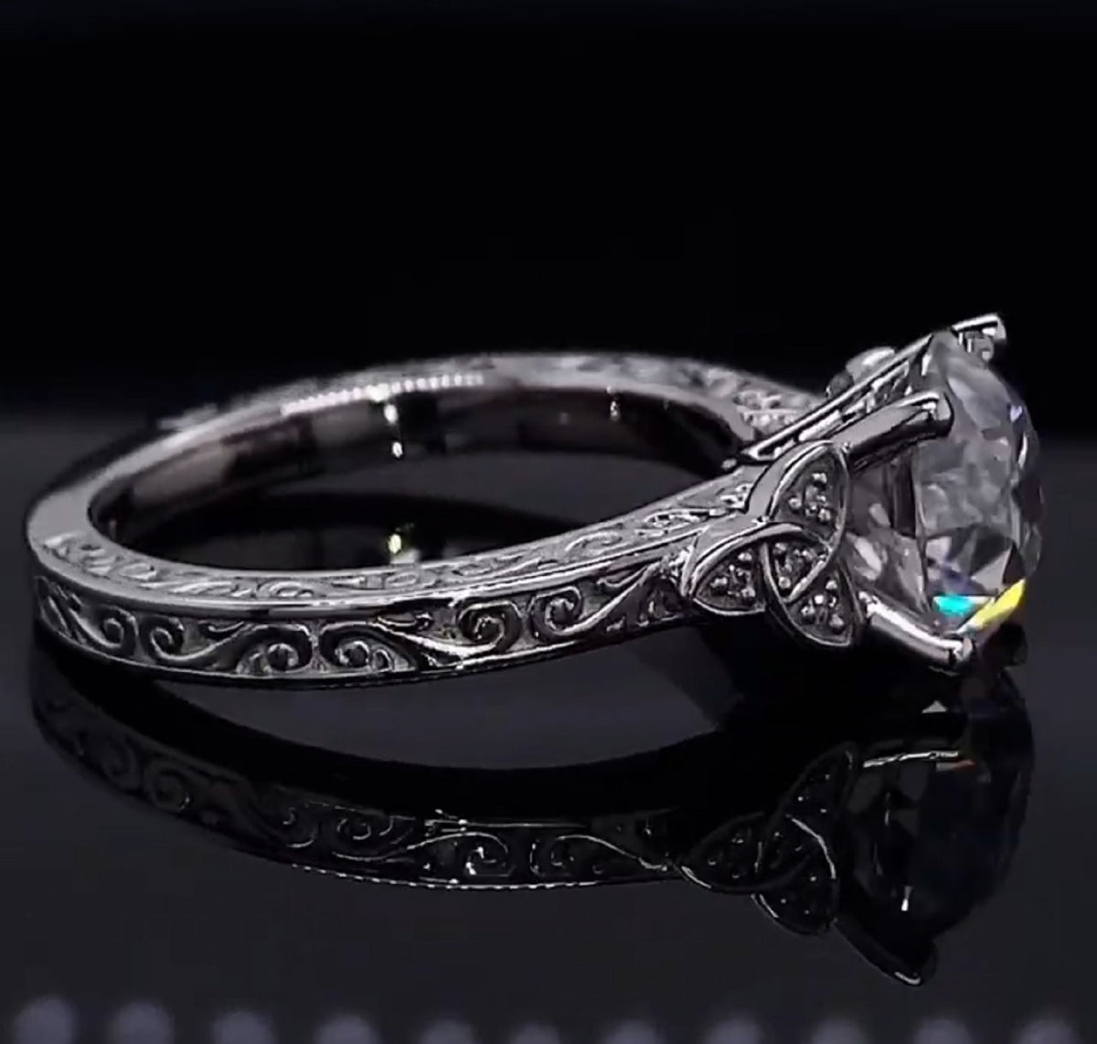 Side profile displaying Celtic trinity knot accents and brilliant round lab diamond