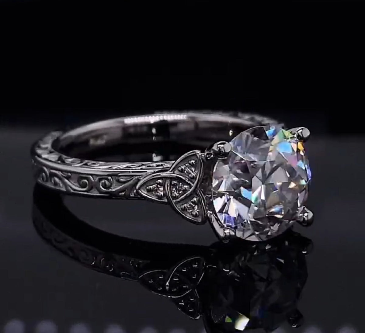 2 CT round cut lab grown diamond ring showcasing sparkle and detailed engraving