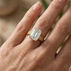 Close-up view of 3 carat emerald cut lab grown diamond ring featuring hand-engraved scrollwork