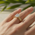 Side angle perspective of a 3 ct emerald cut lab diamond ring in yellow gold